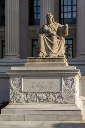 Marble statue with the inscription, "What is Past is Prologue."