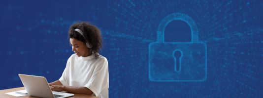 Image of a woman at a computer with a large lock surround by computer code in the background.