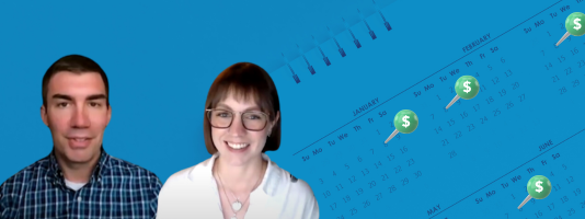 Image of Rob Hoshaw and Abby Jarvis in front of a calendar of pushpins.